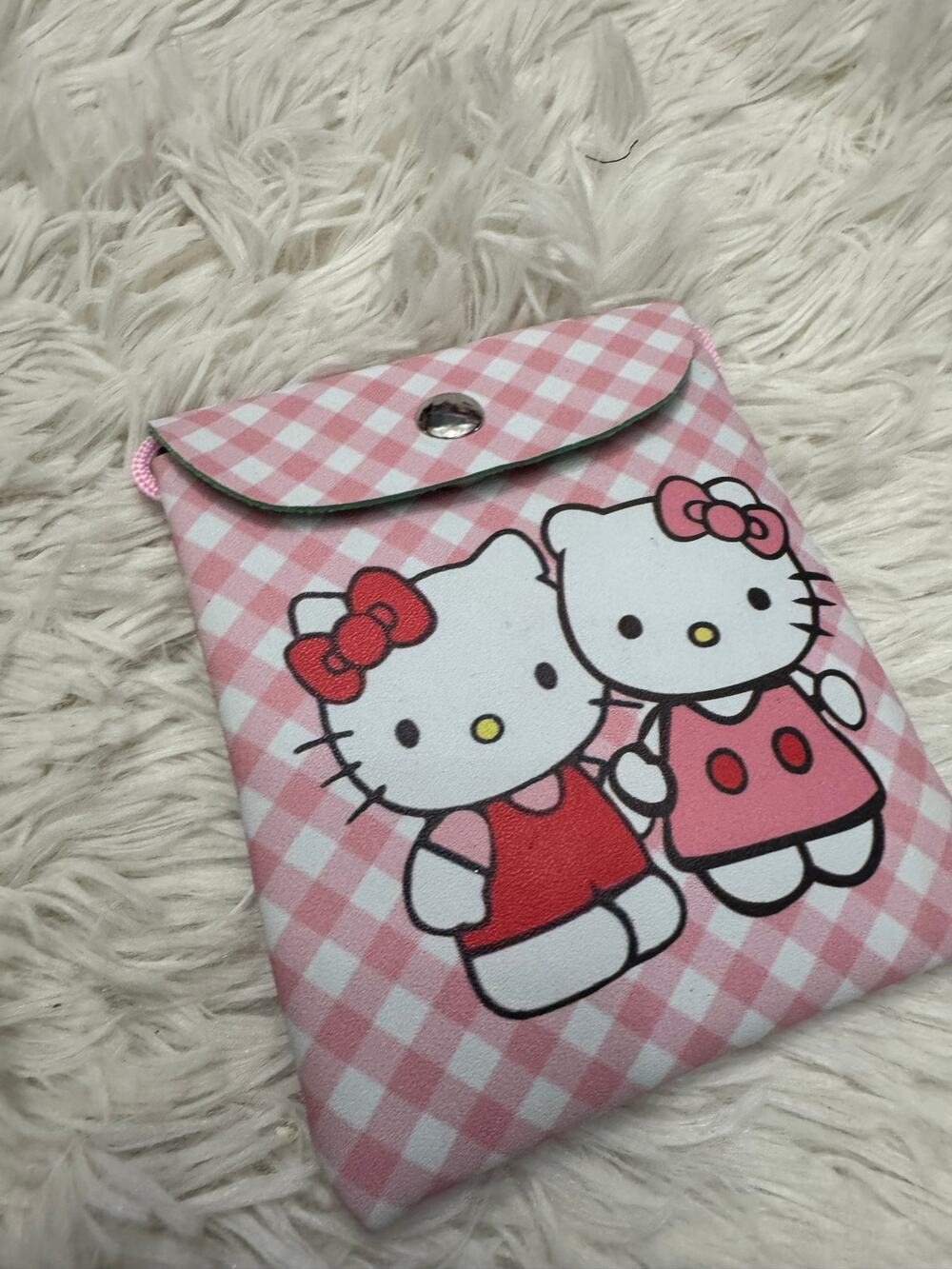 Hello Kitty pink and white checkered crossbody pouch with two Hello Kitty